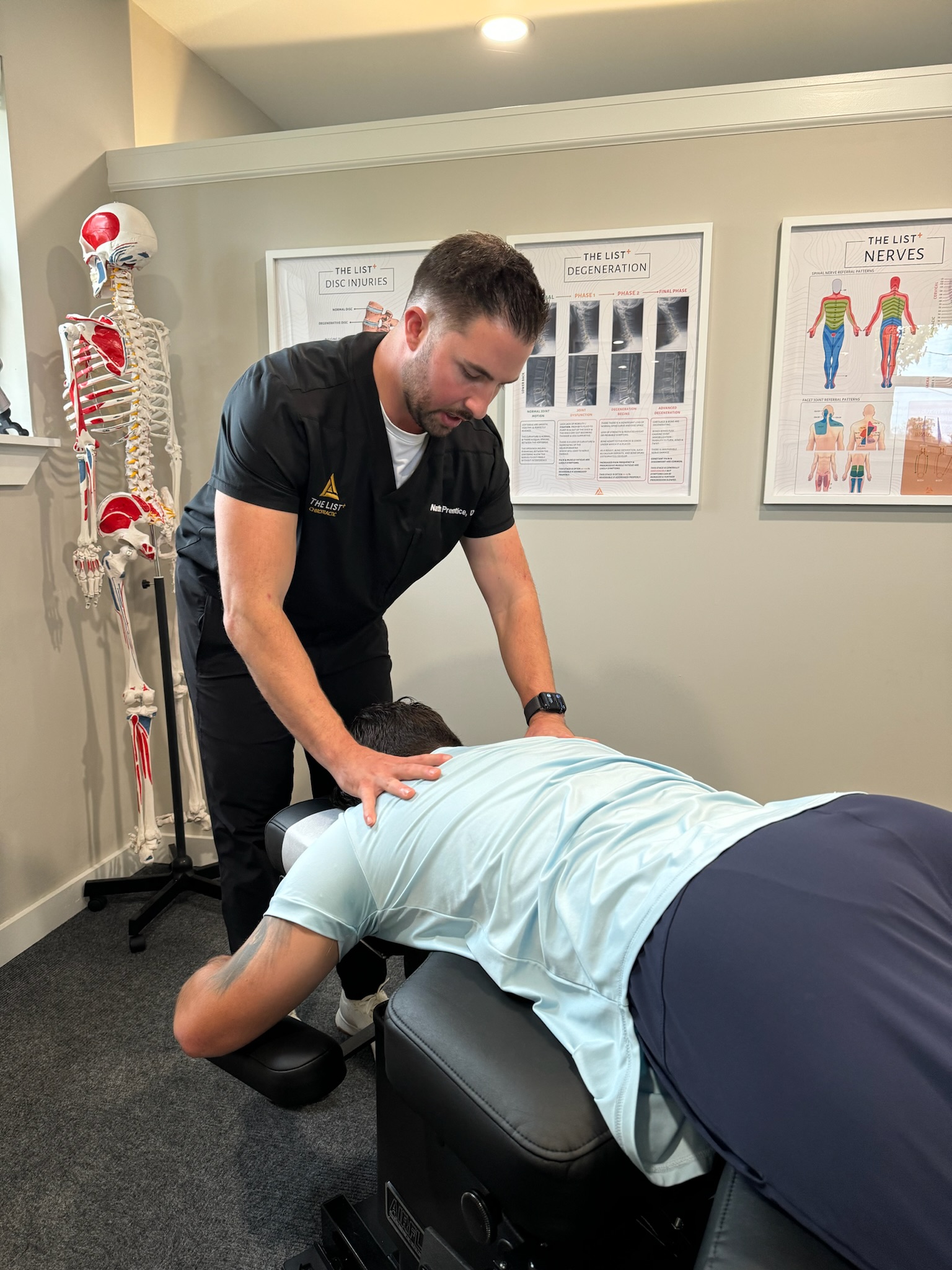 Dr. Nate treating a patient in one of The List Chiropractic treatment rooms.